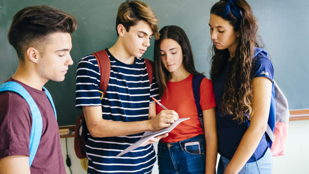 schoolkids writing something down scaled
